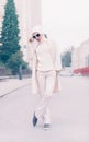 Portrait stylish lady in white glamorous clothes. Fall urban sty Royalty Free Stock Photo