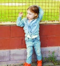 Portrait of stylish little girl child in the jeans clothes Royalty Free Stock Photo