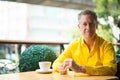 Portrait Of Mature Handsome Man Sitting In Coffee Shop Royalty Free Stock Photo