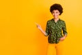 Portrait of stylish positive afro american girl promoter point index finger copy space demonstrate adverts suggest Royalty Free Stock Photo