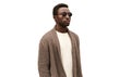 Portrait of stylish young african man model looking away wearing knitted cardigan  on white background Royalty Free Stock Photo