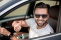 Stylish young man driving a convertible car Royalty Free Stock Photo