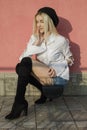 Portrait of stylish young woman in white shirt and knee high boots Royalty Free Stock Photo