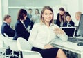 Portrait of succesful smiling young businesswoman in office