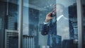 Portrait of Successful African-American Businessman Standing in Office, Making Phone Call to Close Royalty Free Stock Photo