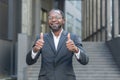 Portrait of successful African American mature businessman, senior man in business suit smiling and looking at camera Royalty Free Stock Photo