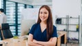 Portrait of successful beautiful executive businesswoman smart casual wear looking at camera and smile, arms crossed in modern Royalty Free Stock Photo