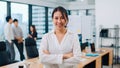 Portrait of successful beautiful executive businesswoman smart casual wear looking at camera and smile, arms crossed in modern Royalty Free Stock Photo