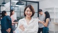 Portrait of successful beautiful executive businesswoman smart casual wear looking at camera and smile, arms crossed in modern Royalty Free Stock Photo