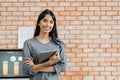 Portrait of successful beautiful executive businesswoman smart casual wear looking at camera and smile, arms crossed in modern Royalty Free Stock Photo