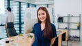 Portrait of successful beautiful executive businesswoman smart casual wear looking at camera and smiling, happy in modern office Royalty Free Stock Photo