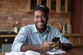 Portrait of successful black male modern day student holding smartphone Royalty Free Stock Photo