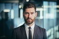 Portrait of a successful boss, photo of a close businessman, successful and pensive looking at the camera, a man with a beard in a