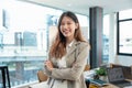 Portrait of successful business asian woman with arms crossed and smile , Young businesswoman smiling and looking at Royalty Free Stock Photo