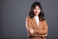 Portrait of successful business asian women with arms crossed and smile isolated over gray background Royalty Free Stock Photo