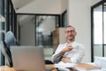 Portrait of successful business man, businessman in glasses and business suit looking at camera and smiling Royalty Free Stock Photo