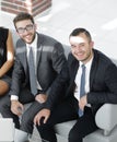 Portrait of successful business team sitting in office lobby Royalty Free Stock Photo