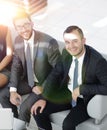 Portrait of successful business team sitting in office lobby Royalty Free Stock Photo