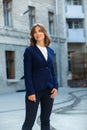 Portrait of a successful business woman in front of modern business building. Royalty Free Stock Photo