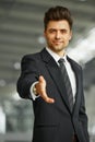 Portrait of a successful businessman giving a hand Royalty Free Stock Photo