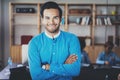 Portrait of successful confident hispanic businessman smiling at the camera in modern office.Horizontal,blurred