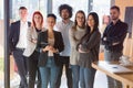 Portrait of successful creative business team looking at camera and smiling. Diverse business people standing together at startup Royalty Free Stock Photo