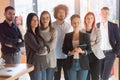 Portrait of successful creative business team looking at camera and smiling. Diverse business people standing together at startup Royalty Free Stock Photo