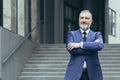 Portrait of successful director and business owner, man with crossed arms smiling Royalty Free Stock Photo