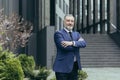 Portrait of successful director and business owner, man with crossed arms smiling Royalty Free Stock Photo