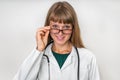 Portrait of successful doctor with stethoscope on white Royalty Free Stock Photo