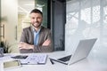 Portrait of successful financier accountant at workplace inside office, senior experienced businessman smiling looking Royalty Free Stock Photo