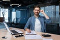 Portrait of successful financier at work at workplace inside office, mature man smiling and looking at camera Royalty Free Stock Photo