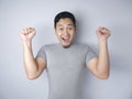 Funny Asian Man Shows Surprised Happy Expression