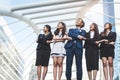 Portrait of successful group of business people looking up to sky as future. Happy businessmen and businesswomen team in Royalty Free Stock Photo