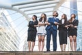 Portrait of successful group of business people looking up to sky as future. Happy businessmen and businesswomen team in Royalty Free Stock Photo