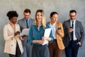 Portrait of successful group of business people at office. Multiethnic group of people smiling. Royalty Free Stock Photo