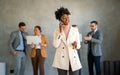 Portrait of successful group of business people at office. Multiethnic group of people smiling. Royalty Free Stock Photo