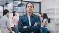 Portrait of successful handsome executive businessman smart casual wear looking at camera and smiling, arms crossed in modern Royalty Free Stock Photo