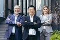 Portrait of successful and happy asian boss with his diverse dream team, business people. Royalty Free Stock Photo