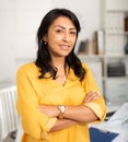 Successful hispanic business woman with arms crossed in office Royalty Free Stock Photo