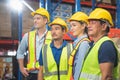 Portrait of successful logistics warehouse workers team, Group portrait of industry workers, Workers in hardhat helmet at