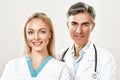 Portrait of successful medical team. Male and female doctors looking at camera and smiling. Working together in a Royalty Free Stock Photo