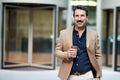 Portrait of successful middle aged businessman drinking coffee outdoor Royalty Free Stock Photo