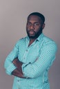 Portrait of successful serious handsome afroamerican man in shirt crossed hands