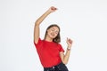 Portrait of successful winner celebrating by dancing. Beautiful young woman  on white background Royalty Free Stock Photo