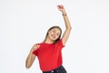 Portrait of successful winner celebrating by dancing. Beautiful young woman  on white background Royalty Free Stock Photo