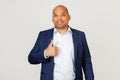 Portrait of a successful young African American businessman guy making a happy hand gesture. Confirming facial expression showing Royalty Free Stock Photo