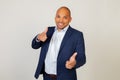 Portrait of a successful young African American businessman guy pointing his fingers at the camera with a happy and funny face. Royalty Free Stock Photo