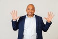 Portrait of successful young African American businessman guy, showing with fingers to number ten, smiling, confident Royalty Free Stock Photo