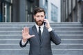 Portrait successful young confident businessman talking background urban modern office building in downtown Bearded business man Royalty Free Stock Photo